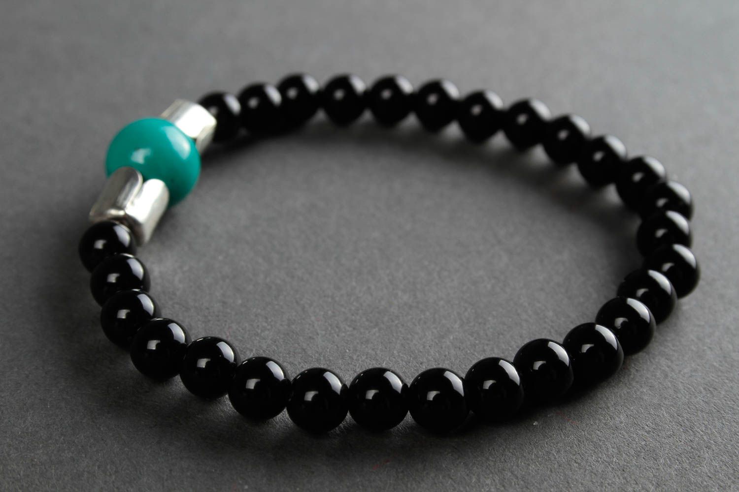 Black beads bracelet on elastic cord and center malachite bead. Unisex bracelet photo 5