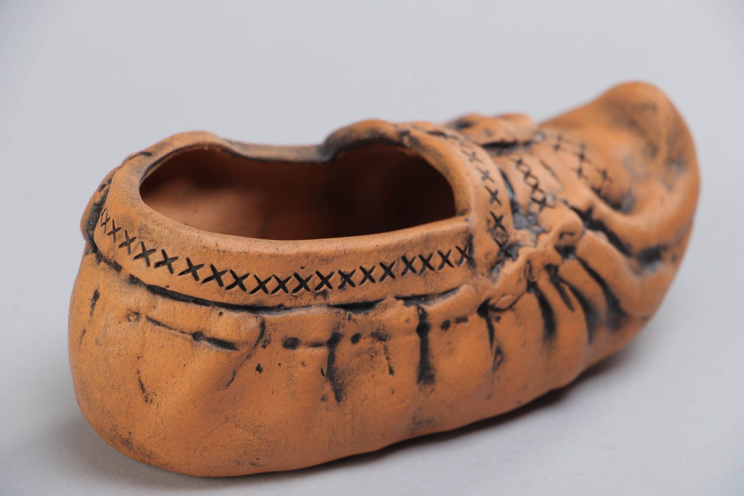 Handmade decorative ceramic ashtray in the shape of shoe kilned with milk photo 4