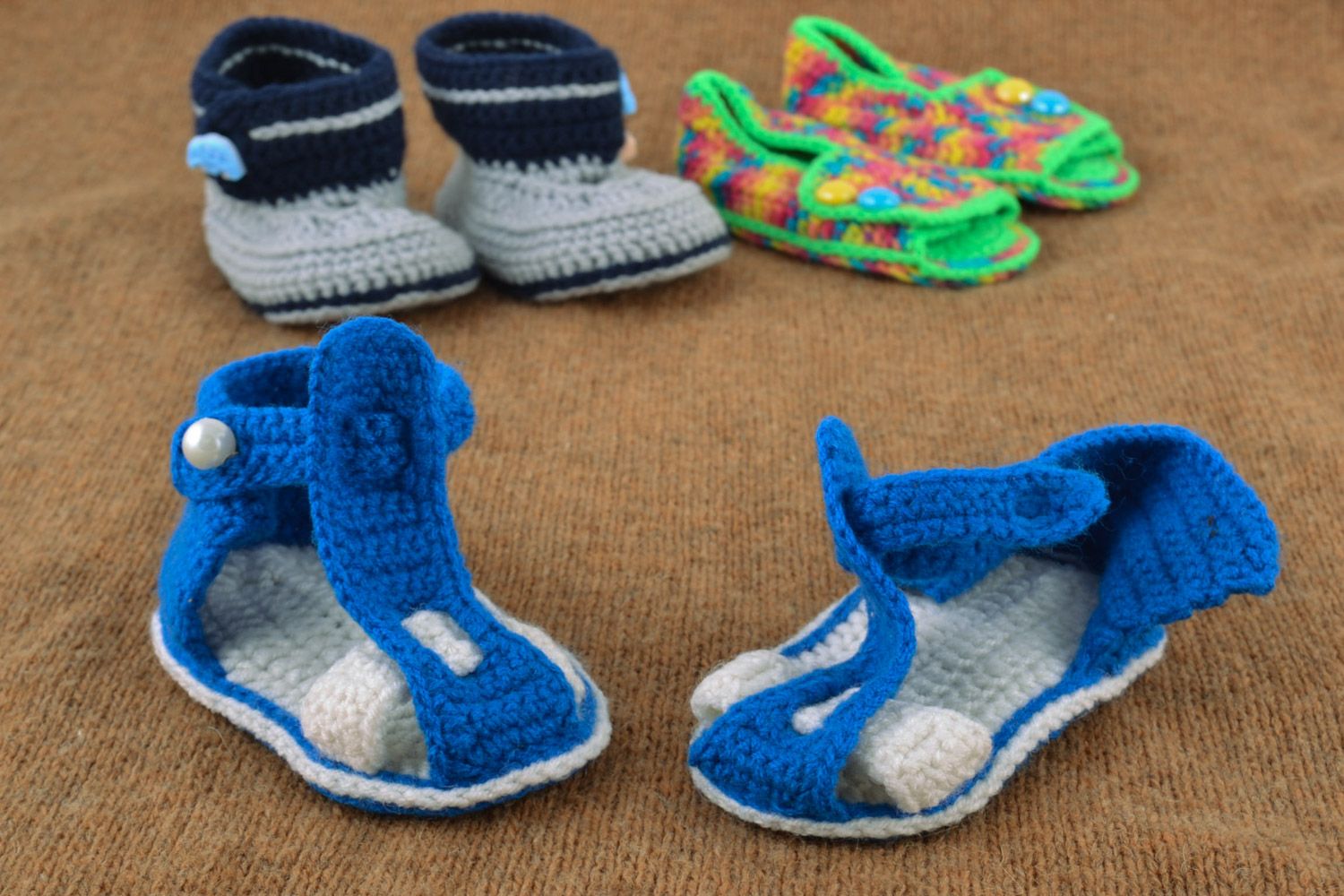 Beautiful handmade knitted baby booties of blue and white colors for boy photo 1