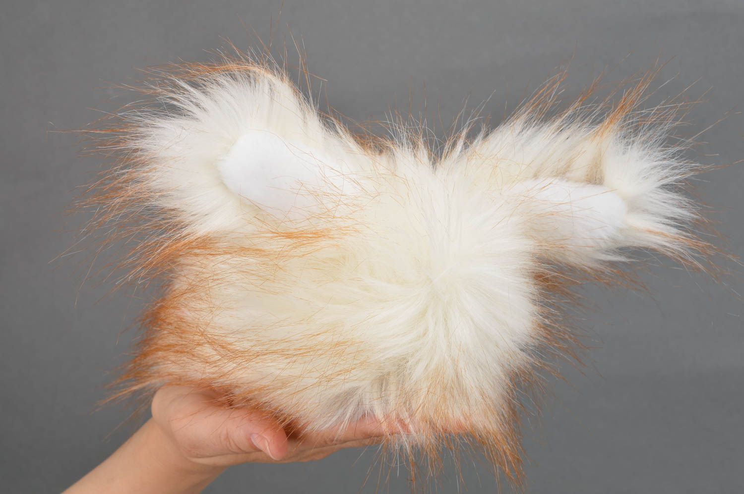 Fluffy stuffed toy in the form of rabbit made of faux fur present for children photo 3