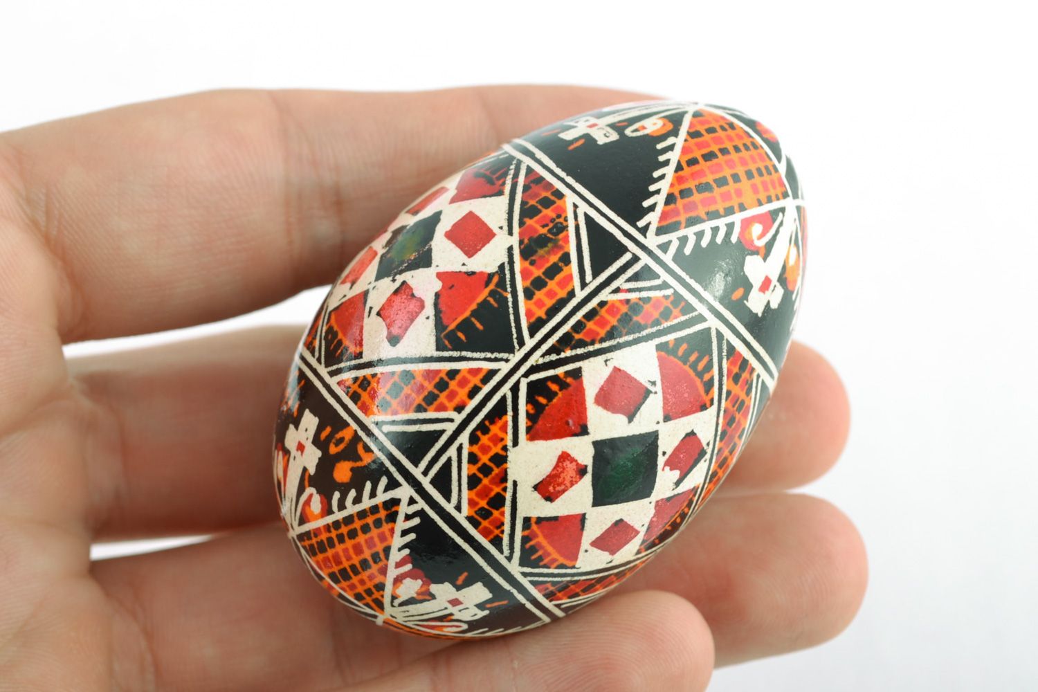 Homemade traditional colorful Easter egg painted with wax and aniline dyes photo 2