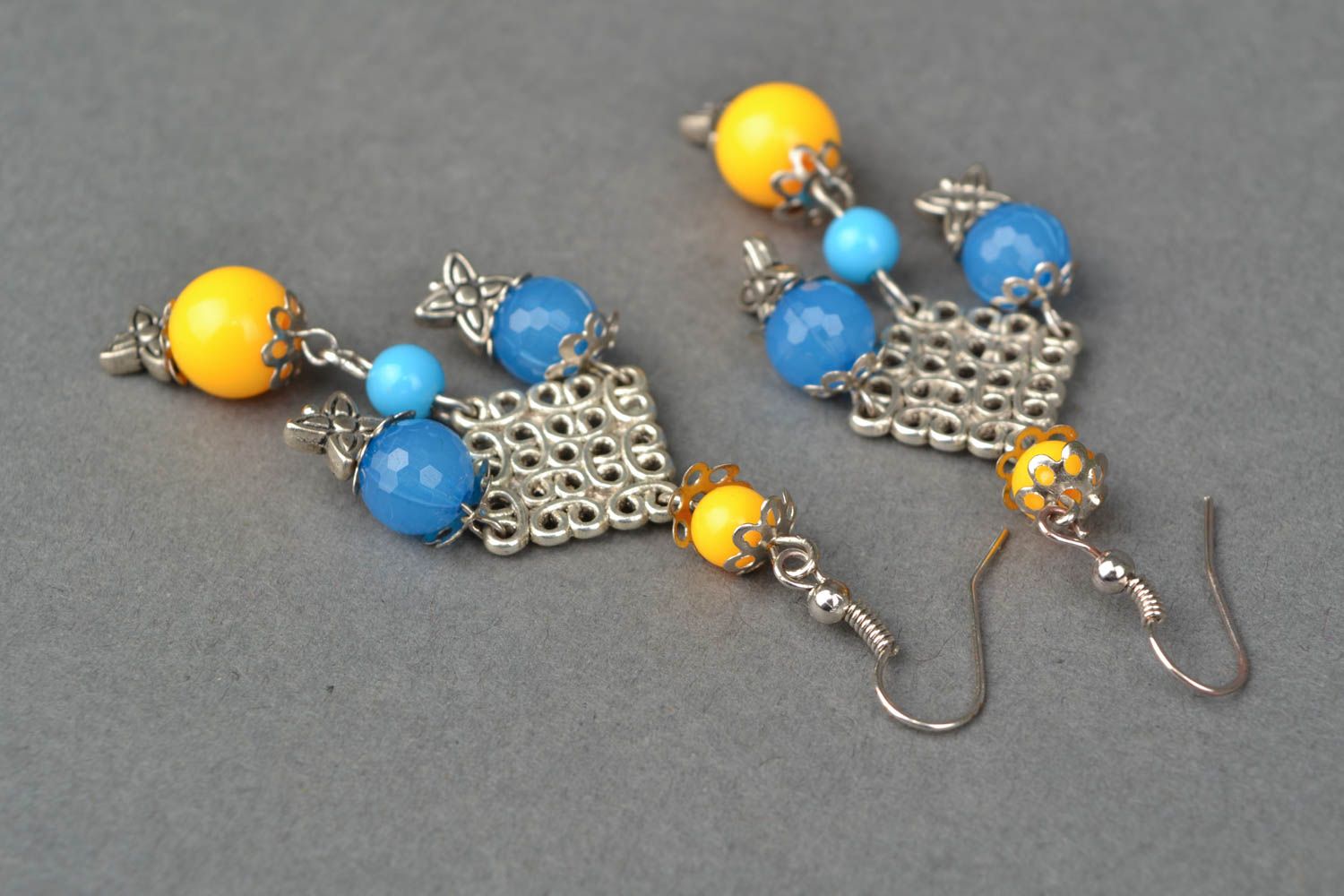 Massive metal earrings with beads photo 4