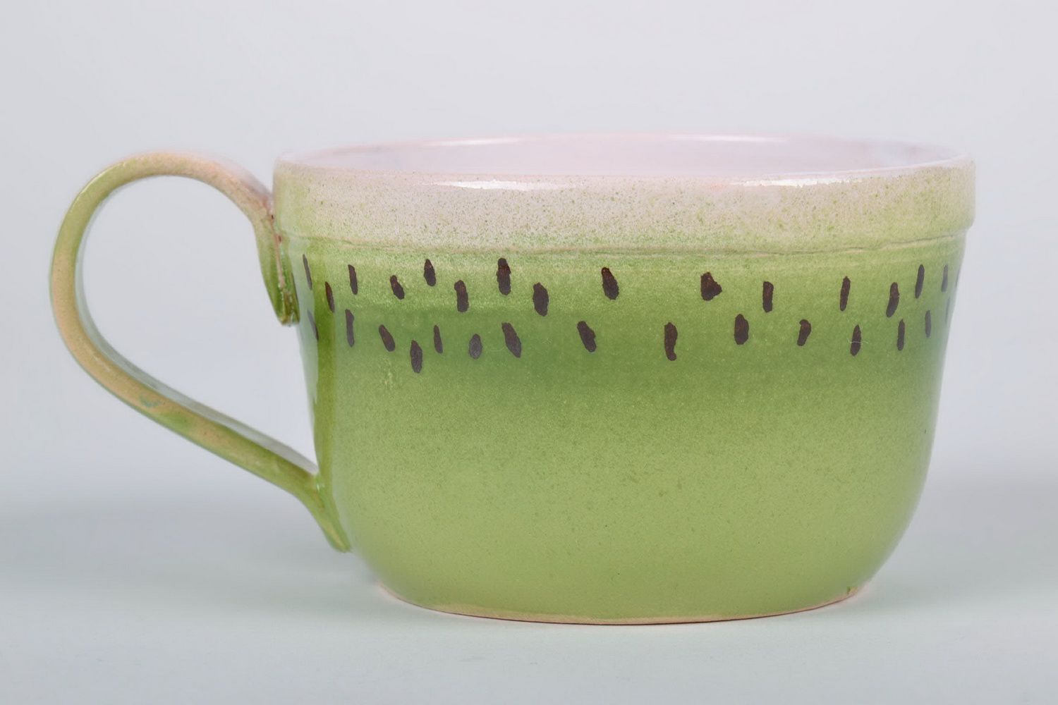 Ceramic glazed cup with handle in kiwi pattern photo 3