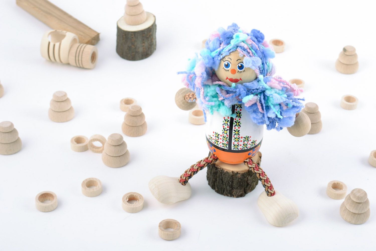 Painted handmade wooden toy for the child in the form of a bright girl doll photo 1