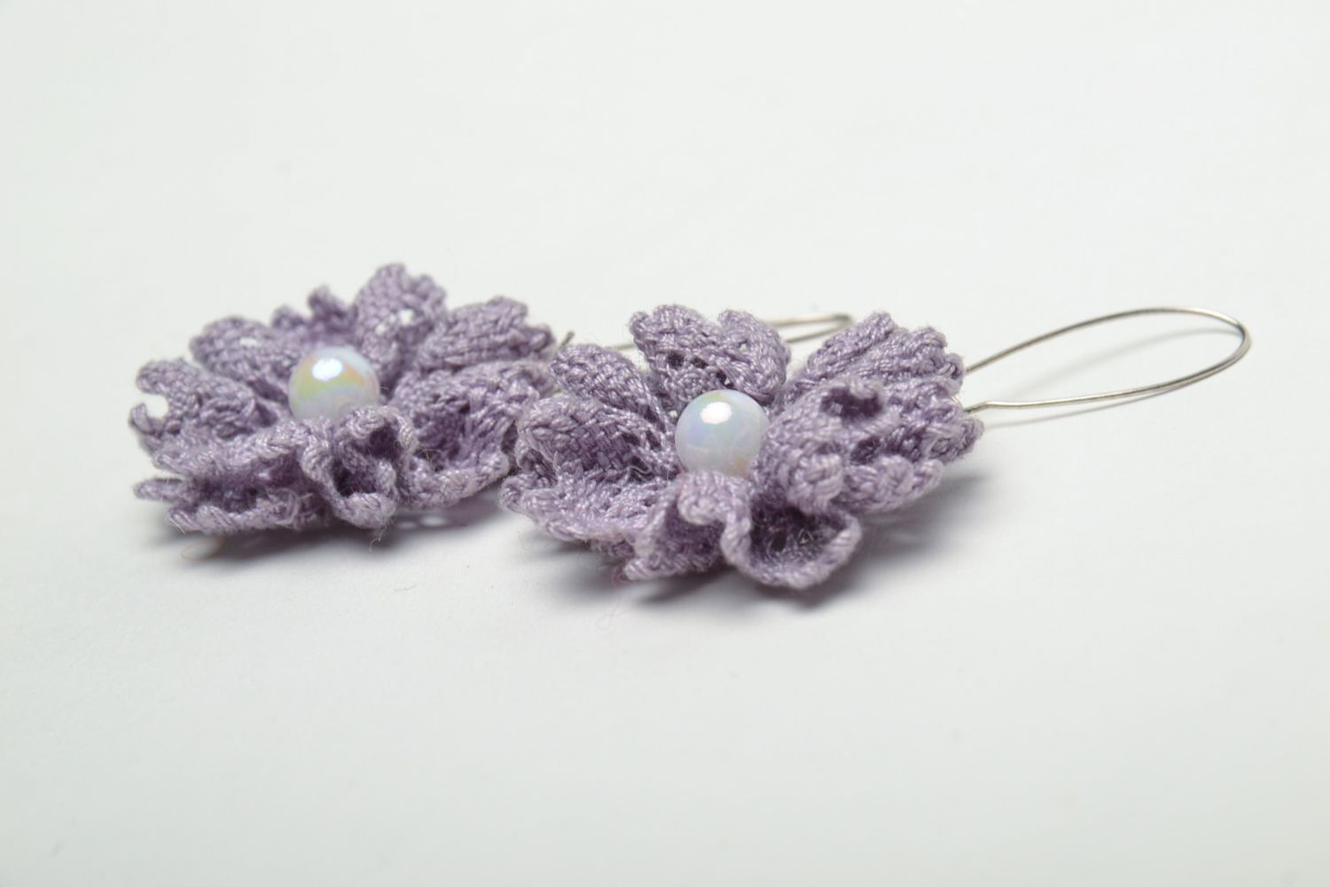 Beautiful lace earrings with pearls in the shape of violet flowers photo 4