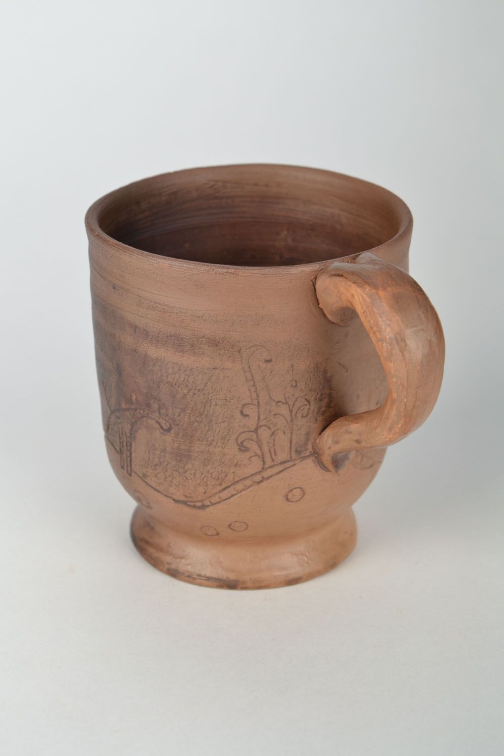 Clay cup for tea in light brown color with Giraffe pattern and handle photo 3
