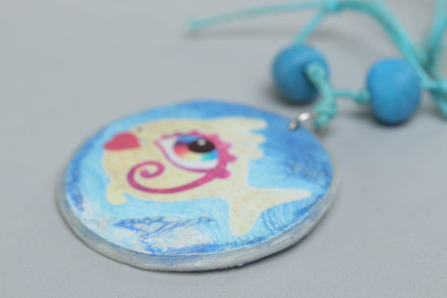Handmade round shape pendant with blue fish print made of polymer clay photo 3