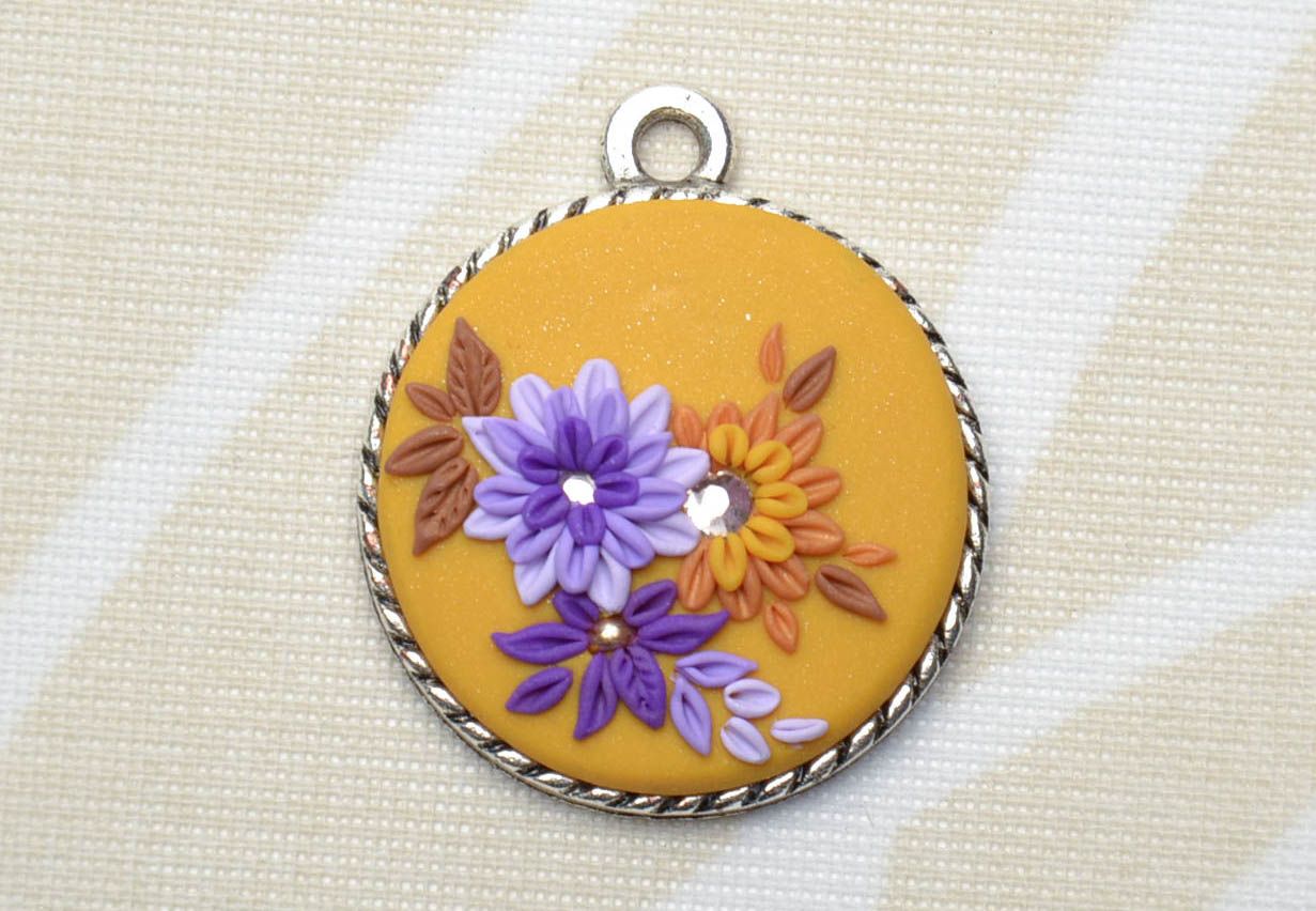 Round polymer clay pendant with flowers photo 1