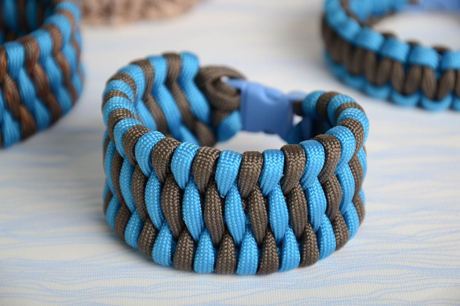 Handmade broad friendship wrist bracelet woven of blue and black paracords  photo 1