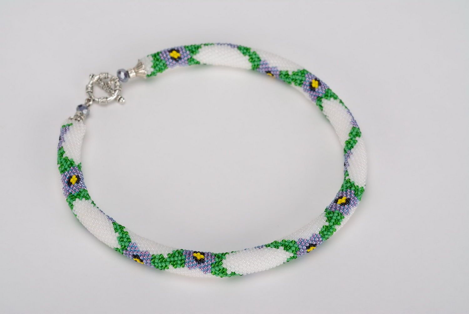 Cord necklace made of beads with floral pattern photo 1