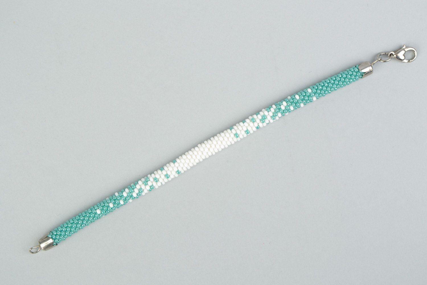 Tender handmade beaded cord wrist bracelet in white and turquoise color  photo 5