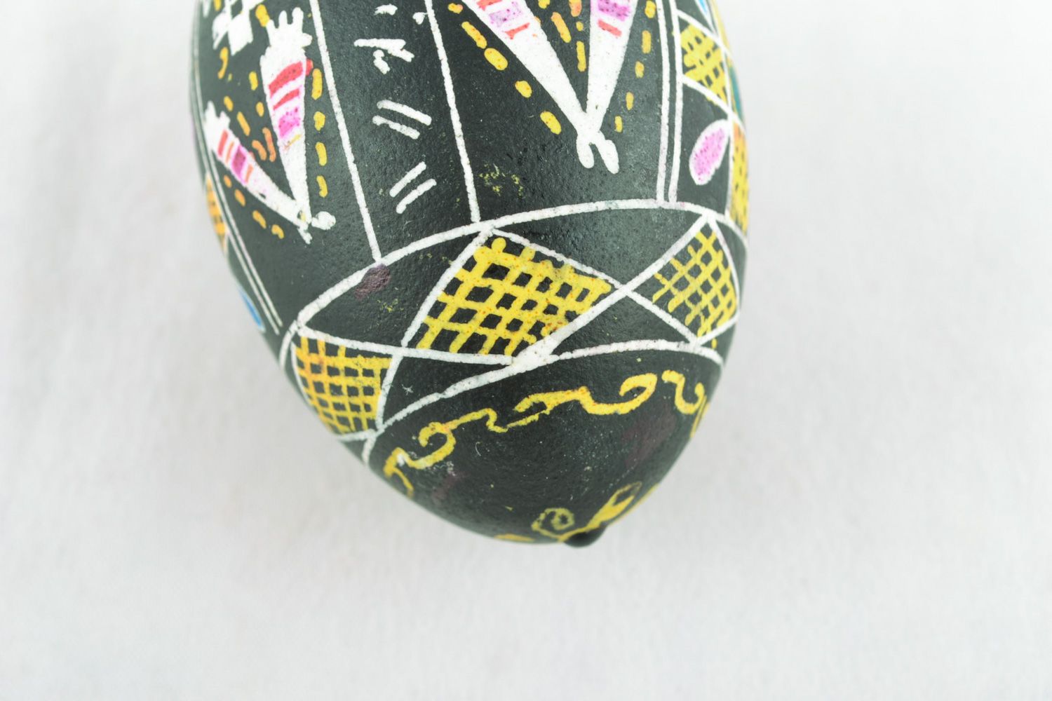 Handmade Easter egg with art painting on black background for interior decoration photo 2