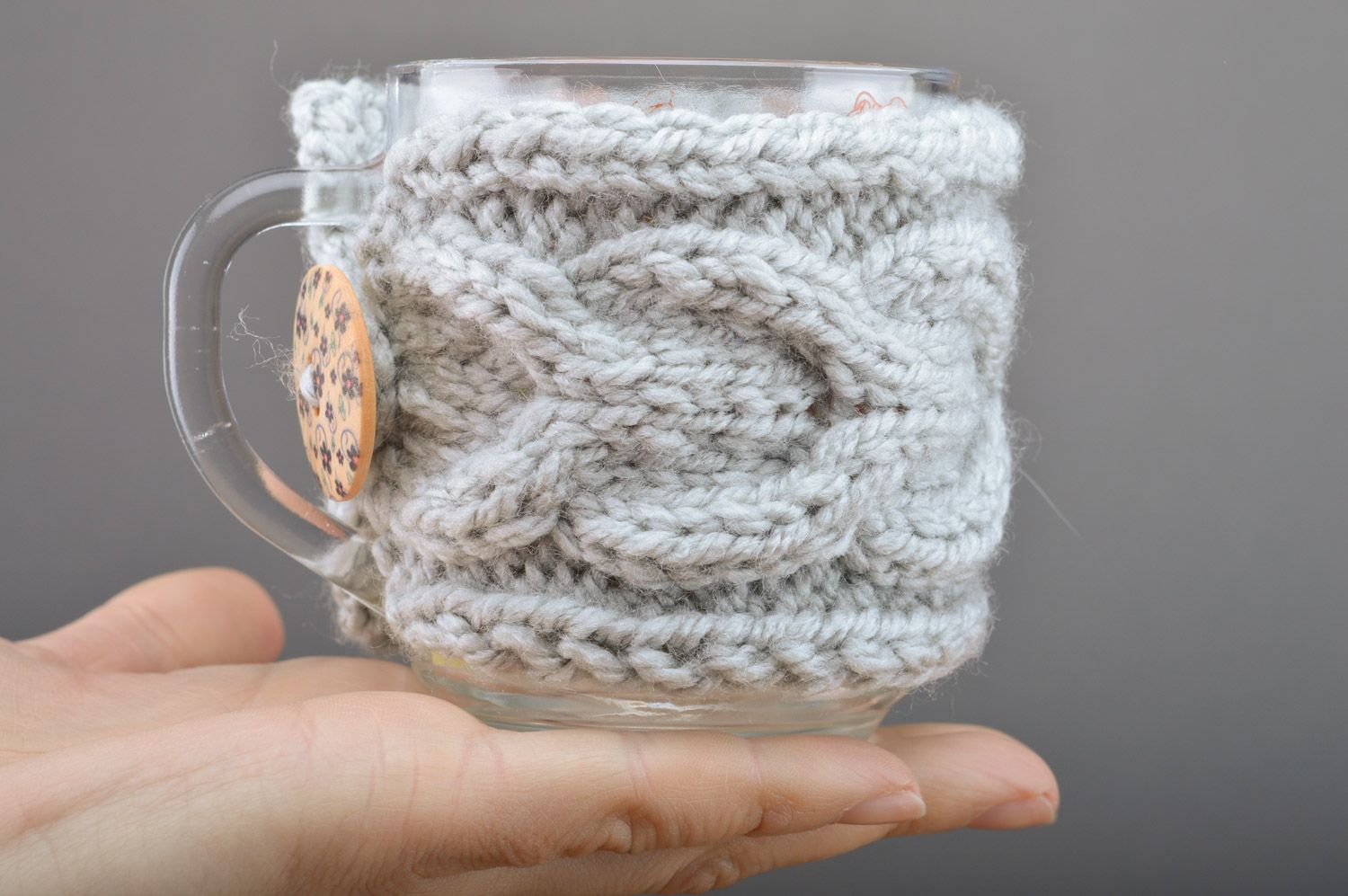 Handmade cup cozy knitted of gray woolen threads with button with floral print photo 3