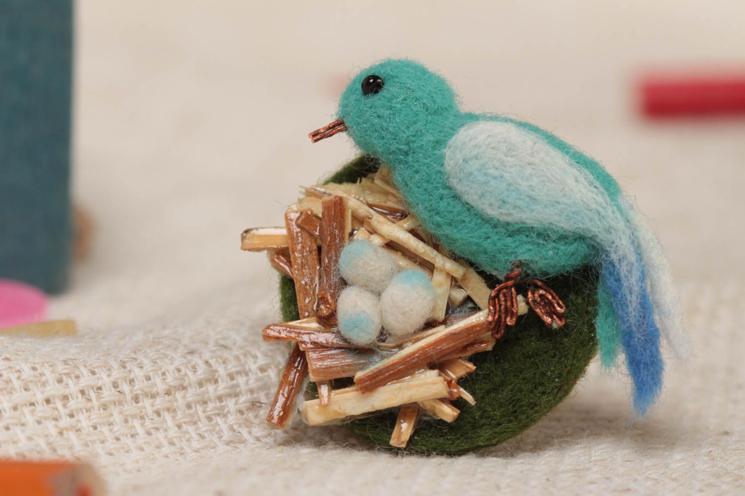 Handmade designer felted wool brooch with blue bird in nest with eggs photo 1