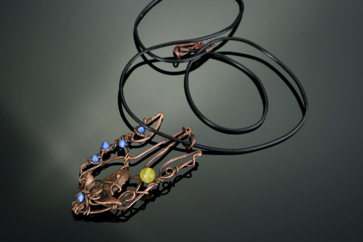 Copper pendant with cat's eye stone photo 2