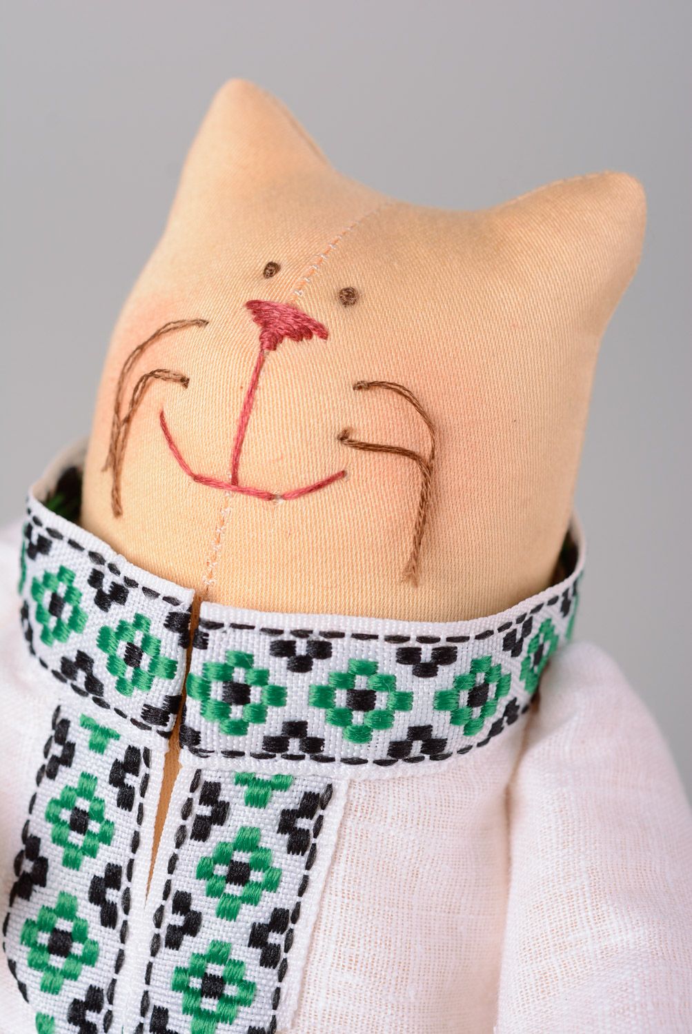 Handmade designer soft toy sewn of cotton in a shape of cat in Ukrainian clothes photo 2