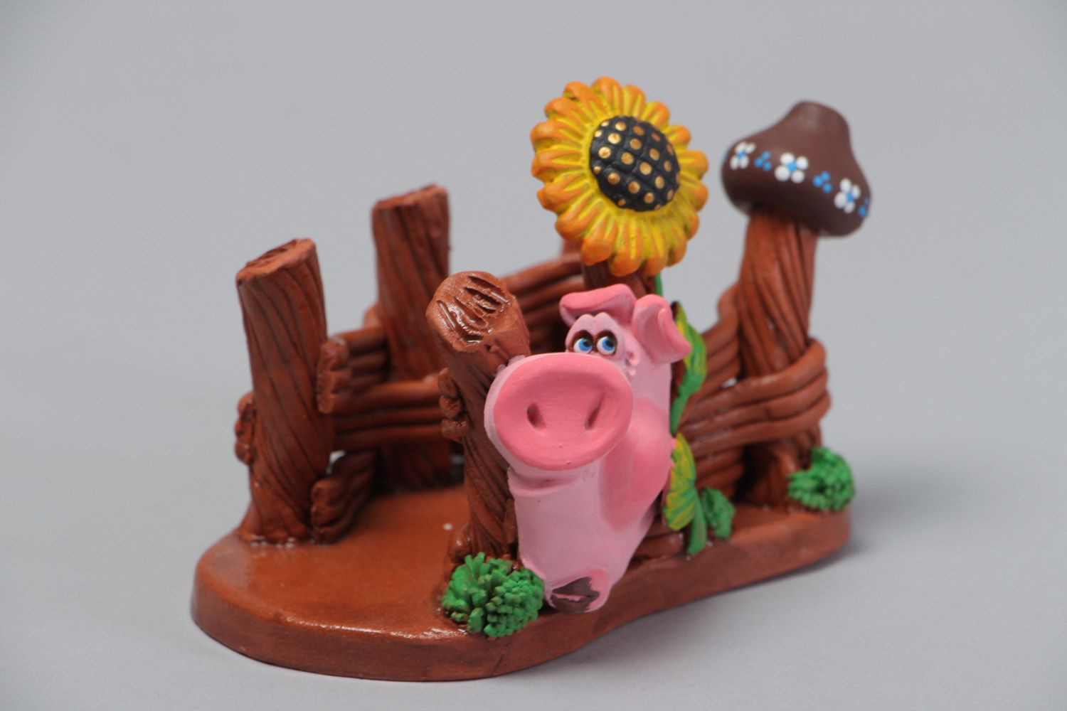 Handmade decorative ceramic napkin holder in the shape of a pig and a fence photo 2