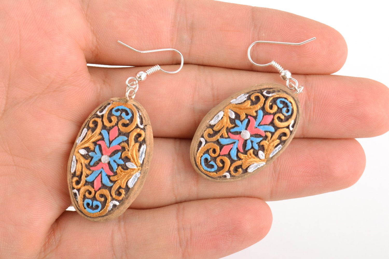 Homemade oval ceramic dangling earrings with ornament painted with acrylics photo 2
