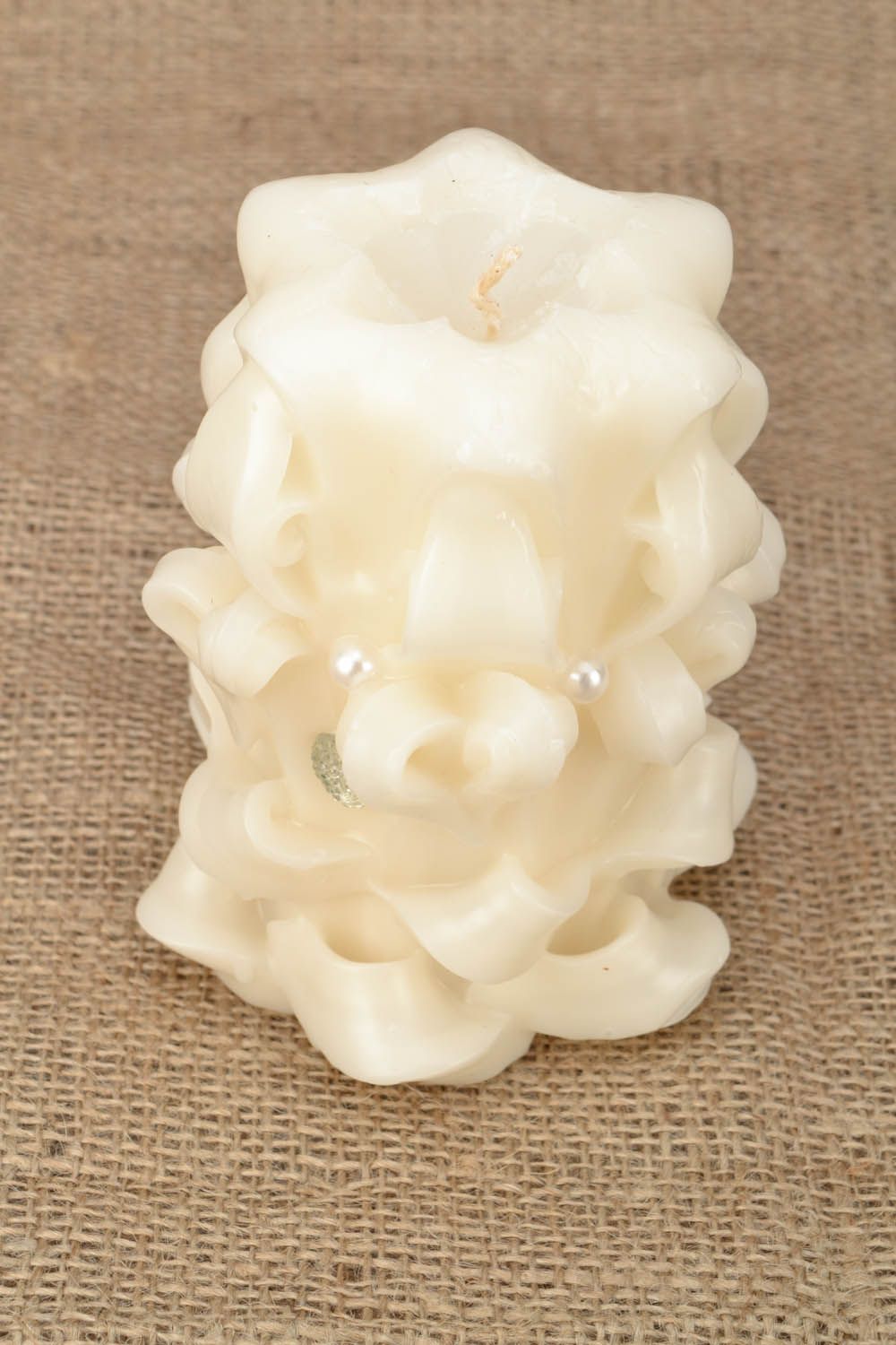 Carved white candle photo 1