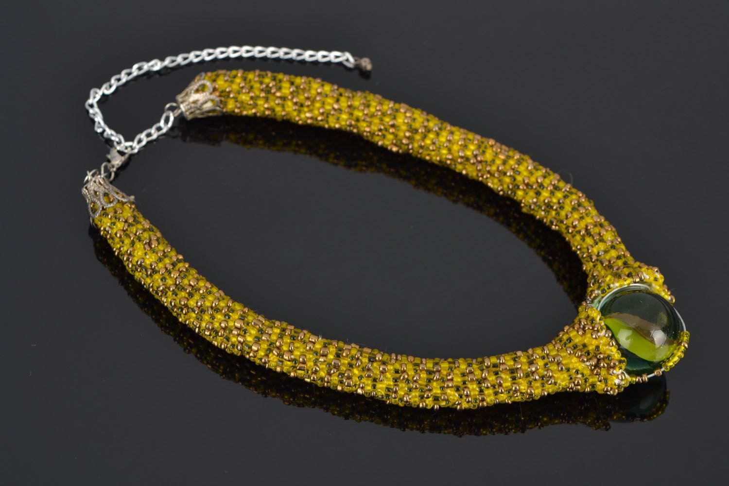 Beaded cord necklace with a glass bead photo 1