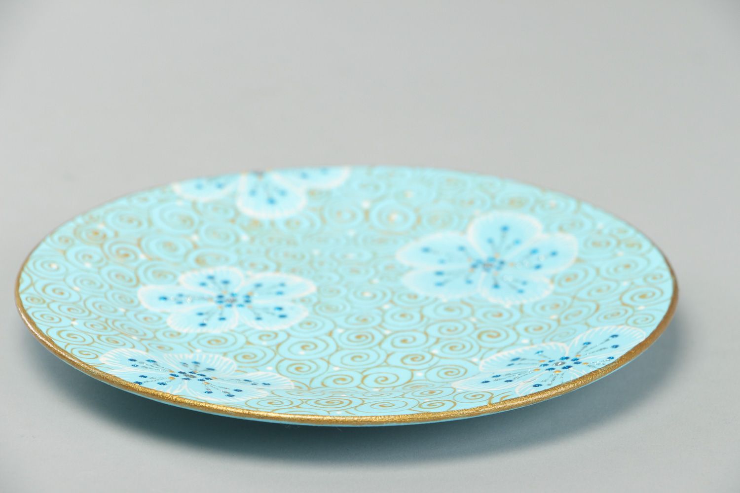 Handmade round ceramic plate with painting in blue color palette for present photo 2
