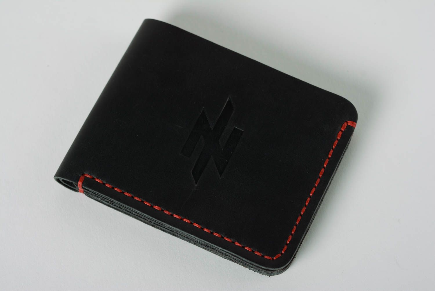Handmade black genuine leather wallet with embossing stitched with red threads photo 2