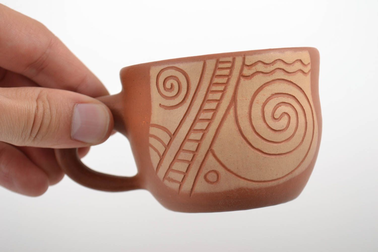 8 oz clay cup in terracotta and beige color with cave drawings photo 2