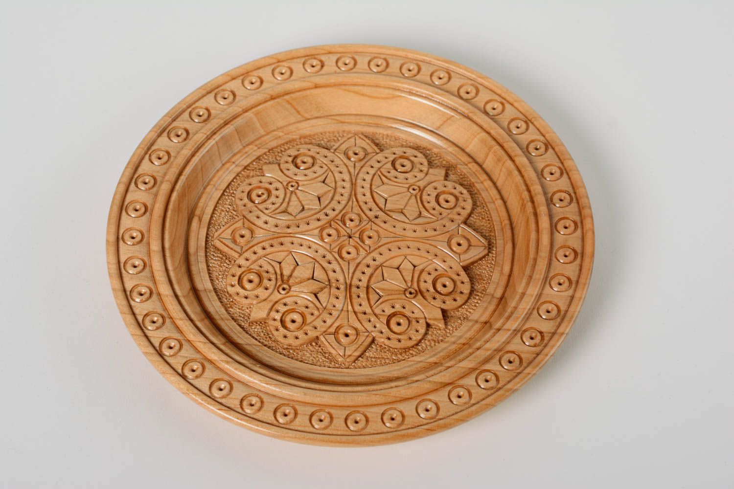 Handmade varnished light wooden plate with art carving for wall decoration  photo 1