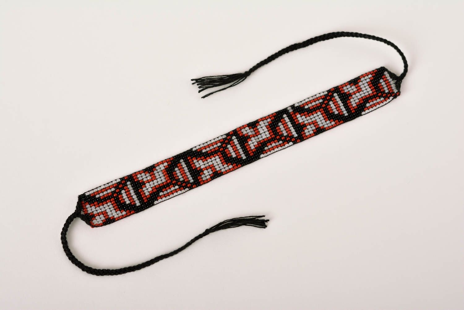 Handmade geometrical ornament beaded bracelet in black, red, gray color photo 5