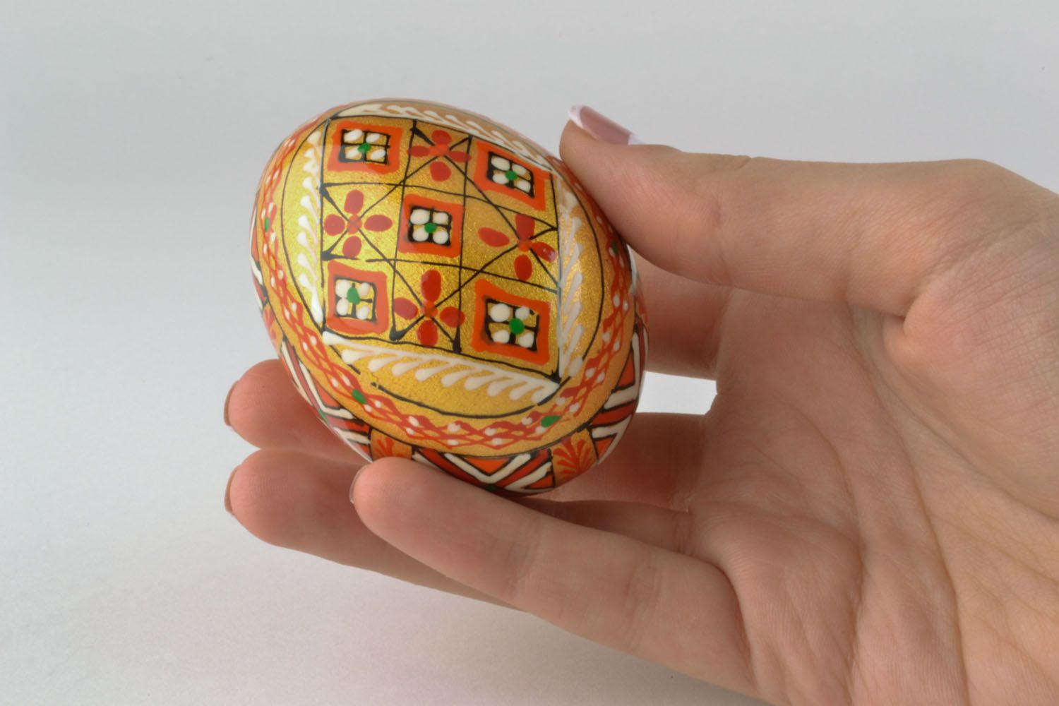 Golden wooden egg with painting photo 2