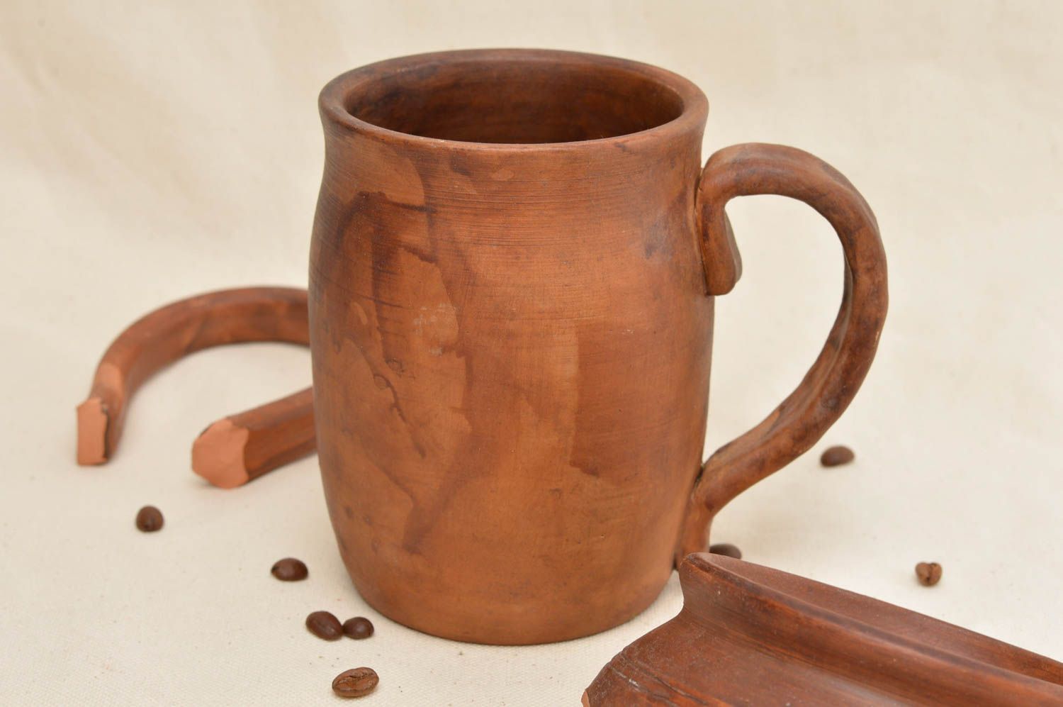 Clay beer drinking mug with handle without a pattern in light brown color photo 1