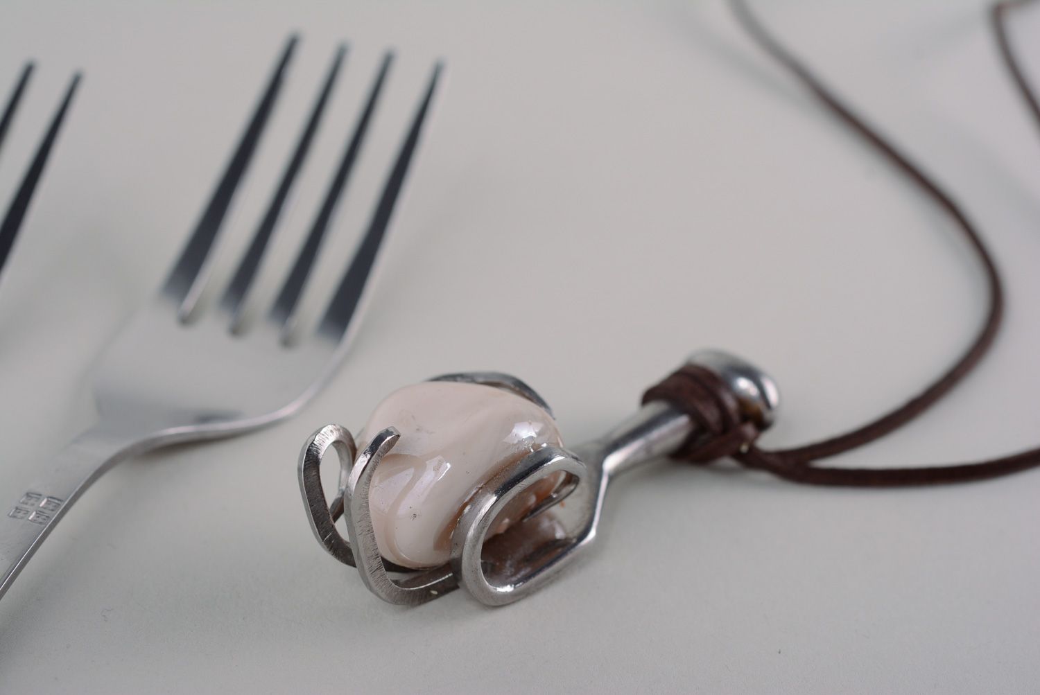 Homemade metal pendant made of cupronickel fork photo 1