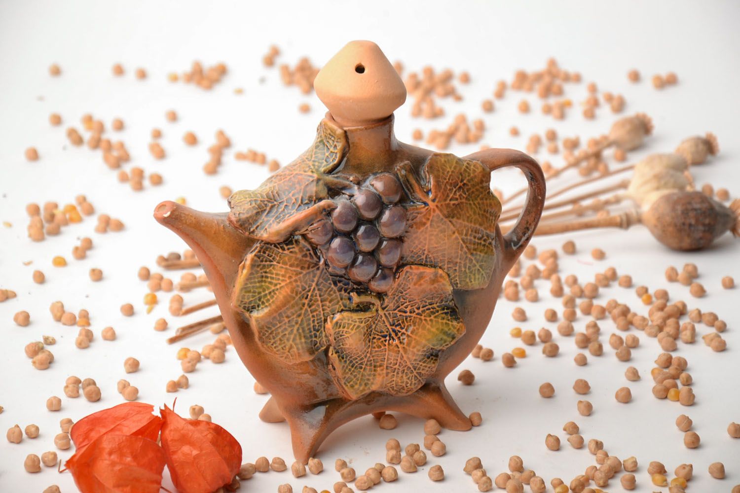 Clay teapot with grape clusters photo 1