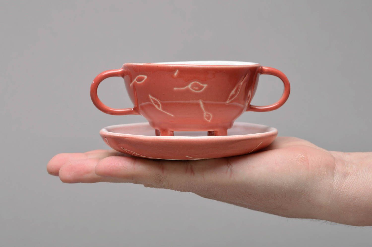 Pink porcelain cup with two handles and round saucer photo 4