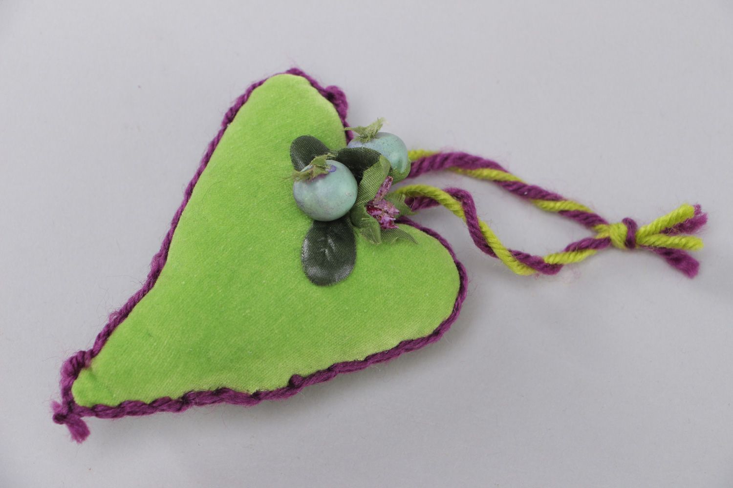 Small handmade heart-shaped wall hanging sewn of green velor for interior decor photo 1