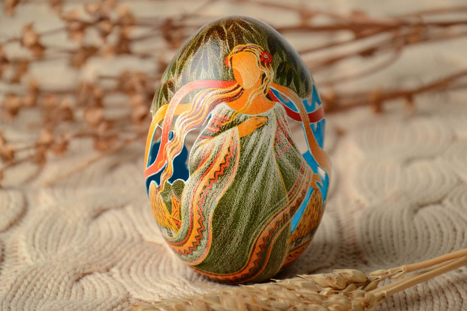 Easter egg painted with aniline dyes and decorated using carving technique photo 1