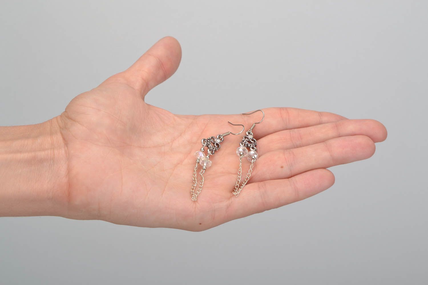 Metall Ohrringe mit Kristall-Perlen foto 2