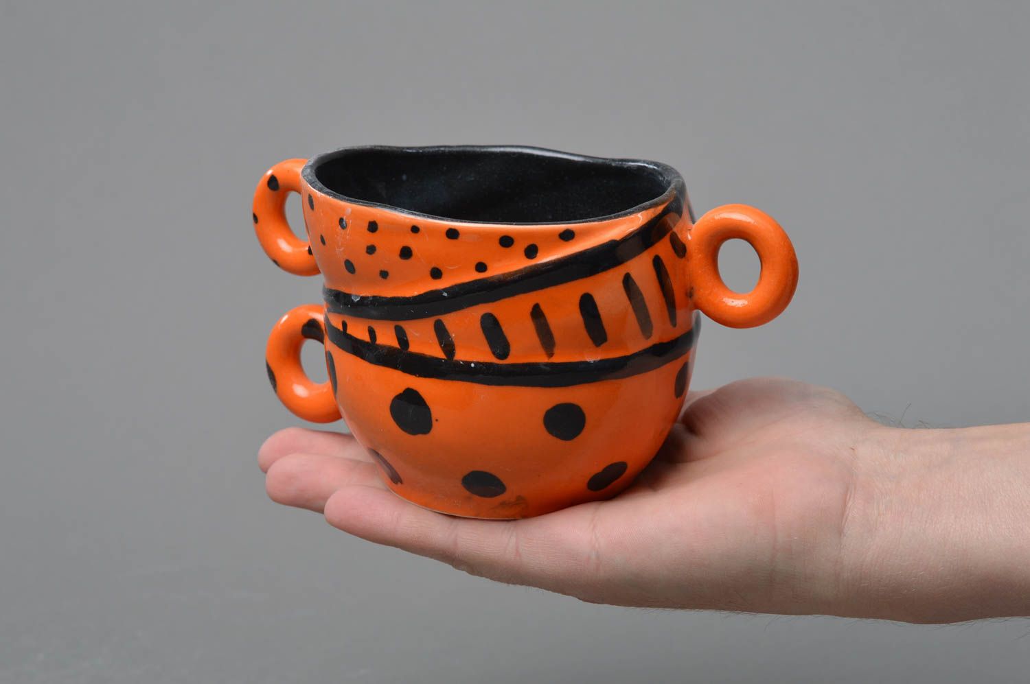 Clay orange and black glazed coffee cup with three handles and black glaze inside photo 4