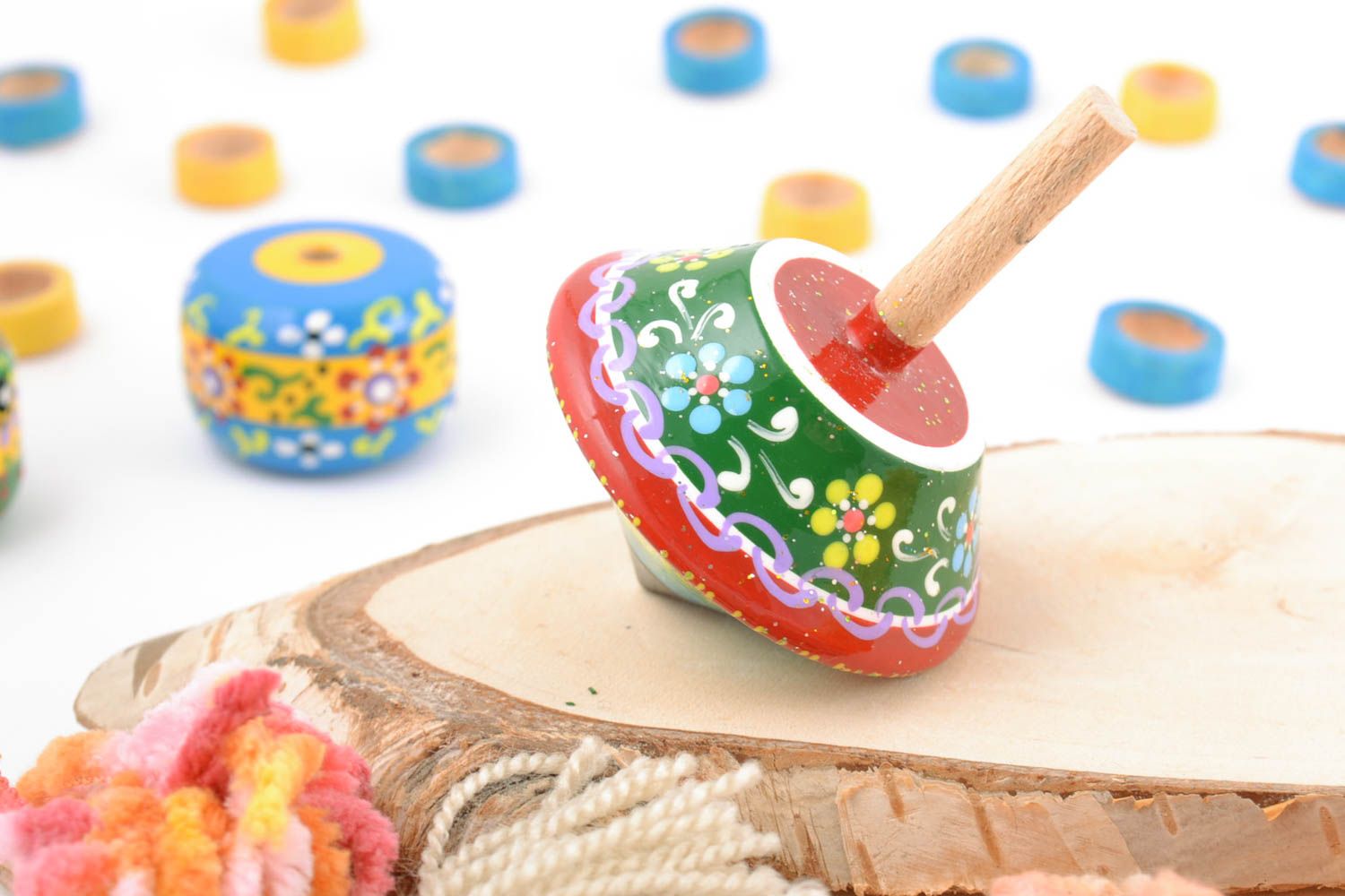 Children's handmade wooden spinning top toy painted with eco dyes photo 1