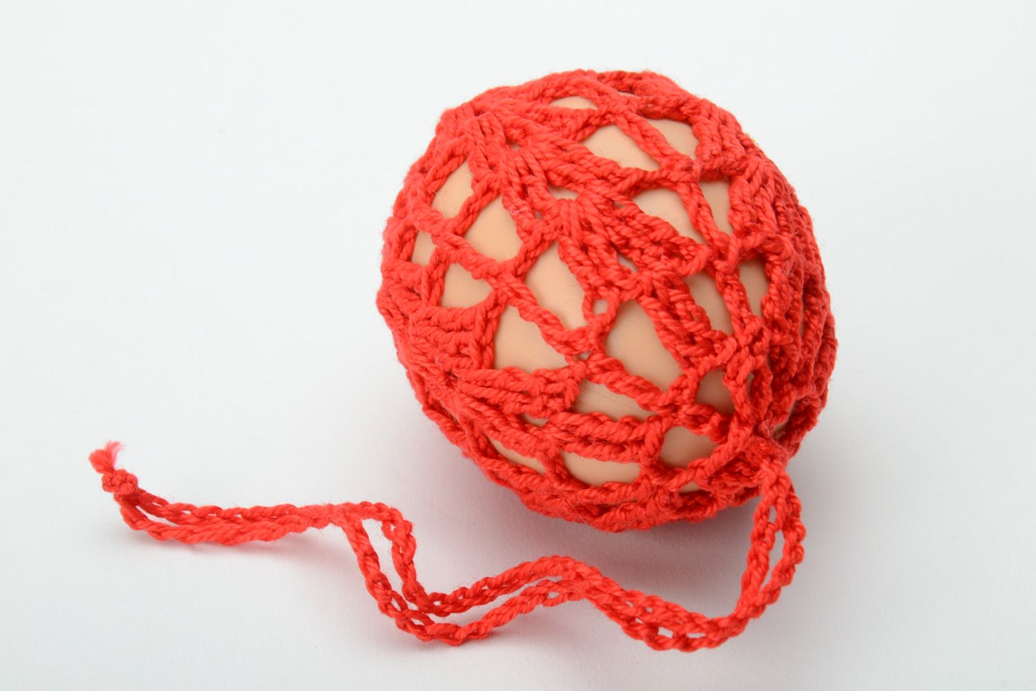 Homemade red decorative Easter egg woven over with threads photo 3