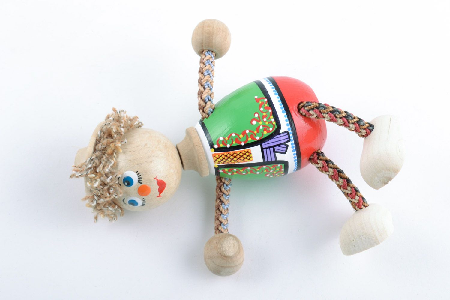 Bright painted handmade wooden toy in the shape of boy photo 5