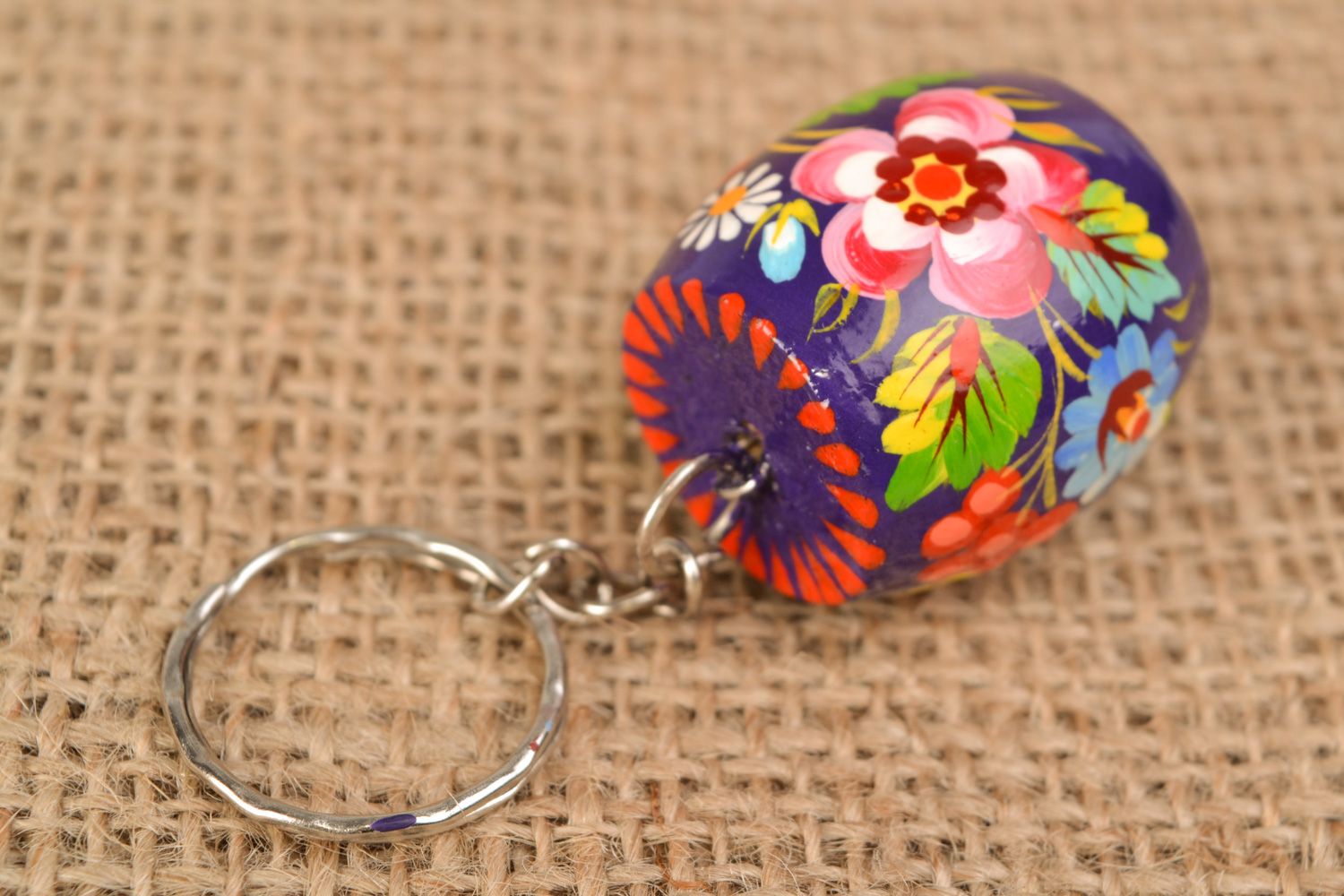 Handmade souvenir barrel-shaped wooden keychain decorated with Petrikivka painting photo 1