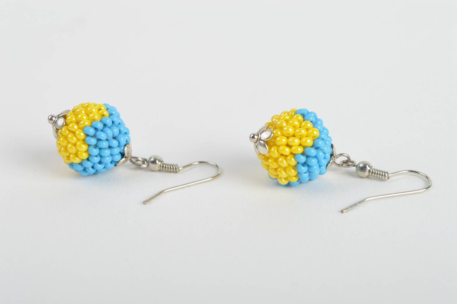 Handmade ball shaped dangle earrings woven of blue and yellow Czech beads photo 4