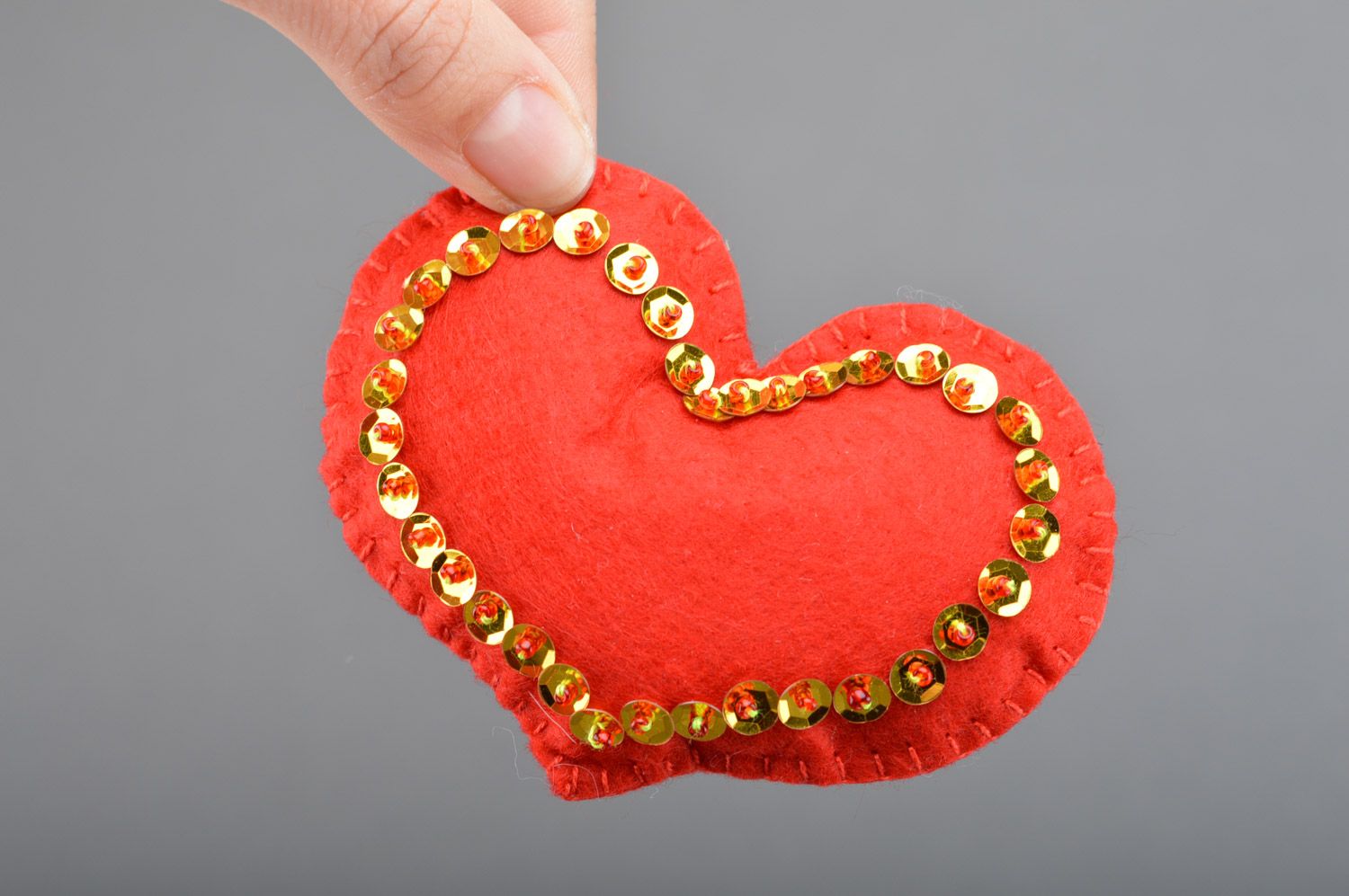 Handmade small red heart sewn of felt with spangles for interior decoration photo 3