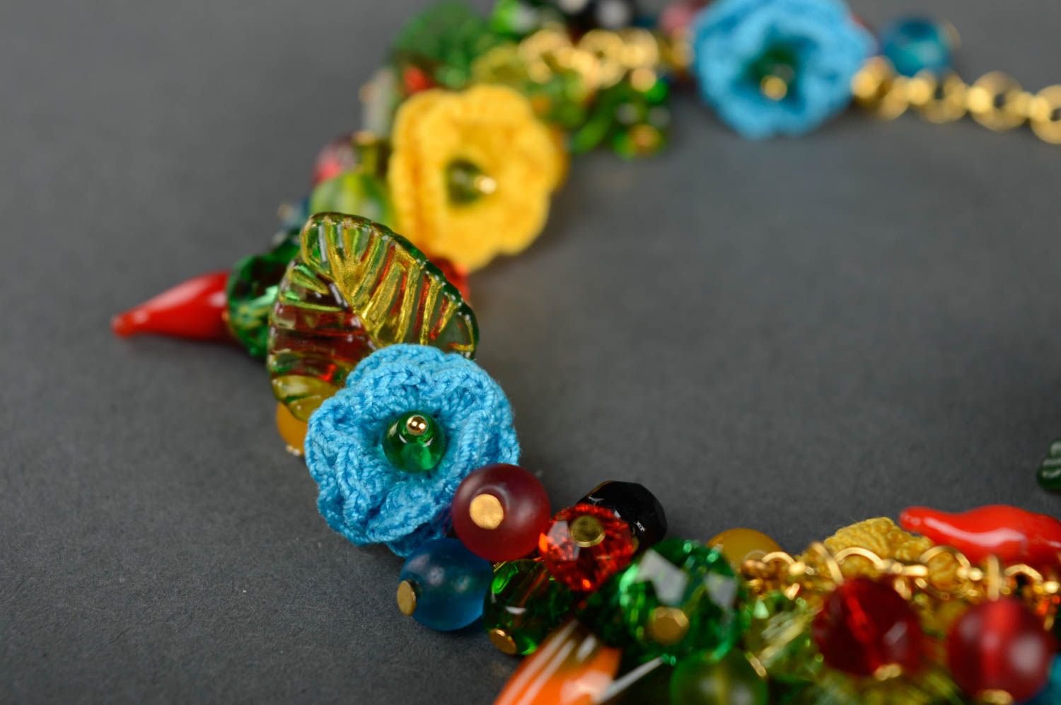 Bright beautiful crochet bracelet with charms and flowers photo 2