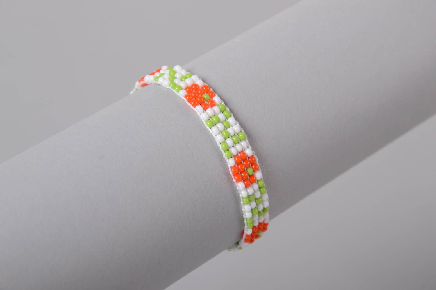 White rope thin line bracelet with red, white, and green beads photo 3