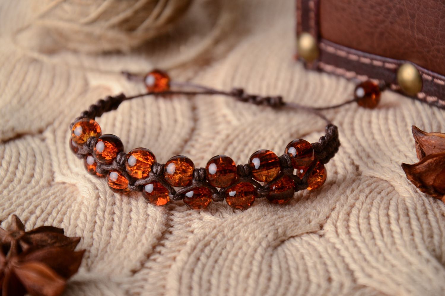 Wrist bracelet made of amber-like beads photo 1