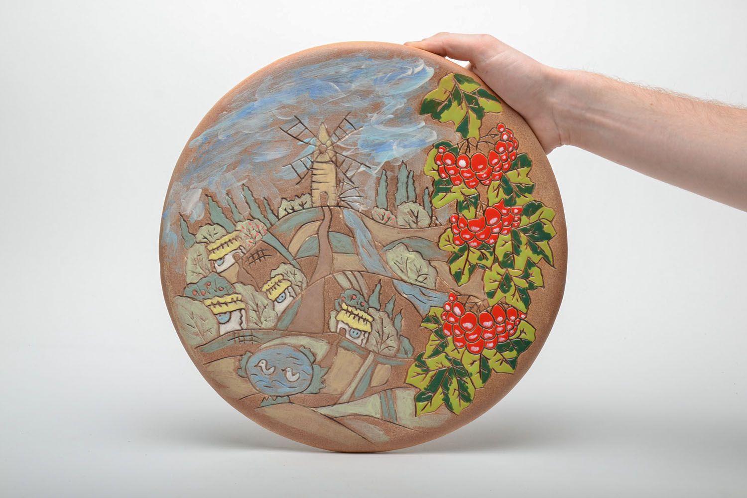 Настенная керамическая тарелка расписанная глазурью фото 5