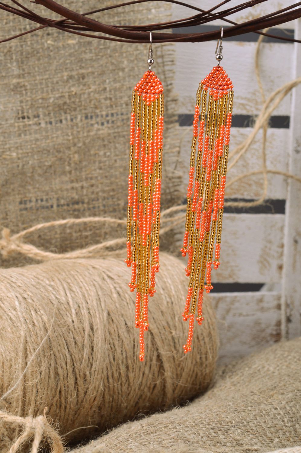 Stylish long handmade beaded earrings with fringe of golden and red colors photo 1