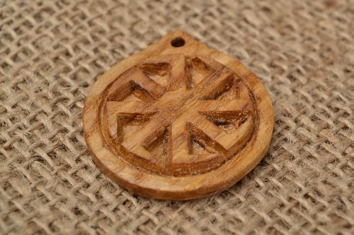 Handmade carved small round wooden neck pendant with Slavic symbol Kolovrat - MADEheart.com